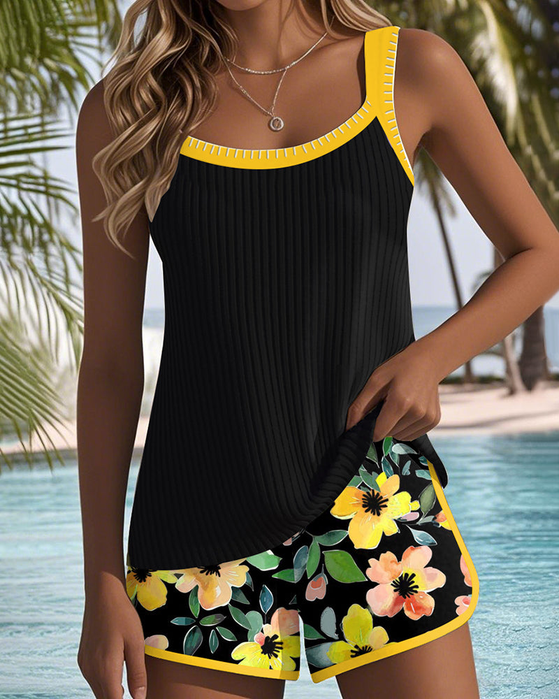 Sophie – Black tankini with floral print and beach shorts