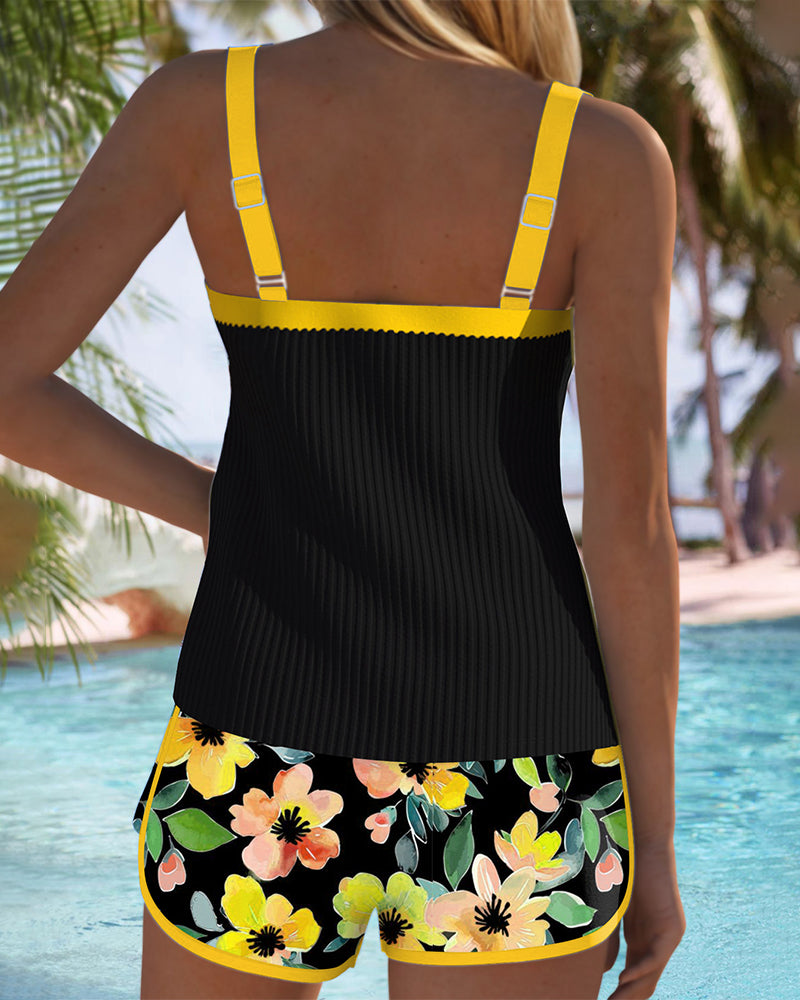 Sophie – Black tankini with floral print and beach shorts