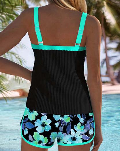 Sophie – Black tankini with floral print and beach shorts