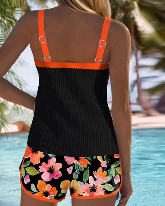 Sophie – Black tankini with floral print and beach shorts